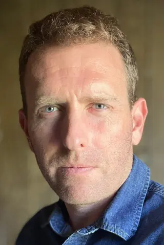 Тревіс Міллс